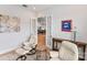 A cozy sitting area with white leather chairs and a view of a room with french doors at 45523 Misty Bluff Dr, Charlotte, NC 28278