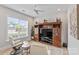 Bright living room featuring built in shelving with a large window and two white chairs at 45523 Misty Bluff Dr, Charlotte, NC 28278