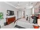Spacious main bedroom features a trey ceiling, dresser, and a television for relaxation at 45523 Misty Bluff Dr, Charlotte, NC 28278