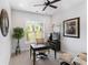 Bright home office with a dark desk, large window, and comfortable leather chairs at 45523 Misty Bluff Dr, Charlotte, NC 28278