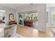 Stylish sun room with comfortable seating, leads to outdoor patio with sliding glass doors at 45523 Misty Bluff Dr, Charlotte, NC 28278