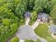 Aerial shot showcases a well-manicured neighborhood with lush trees surrounding beautiful homes and driveways at 4790 Cascade Ave, Rock Hill, SC 29732