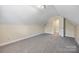 Attic space with carpet and neutral walls, with open doorway to stairs at 4790 Cascade Ave, Rock Hill, SC 29732