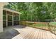 Spacious back deck with wood railings and views of the screened porch and backyard at 4790 Cascade Ave, Rock Hill, SC 29732