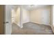 Neutral-toned carpeted bedroom featuring a doorway and a closet door at 4790 Cascade Ave, Rock Hill, SC 29732