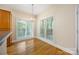 Bright dining area with hardwood floors and natural light streaming through large windows, perfect for Gathering meals at 4790 Cascade Ave, Rock Hill, SC 29732
