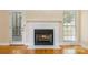 Cozy fireplace with white mantel, white tile surround, and glass door access to outside at 4790 Cascade Ave, Rock Hill, SC 29732