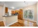Charming kitchen with wood cabinets, breakfast bar, and modern appliances, ideal for cooking and entertaining at 4790 Cascade Ave, Rock Hill, SC 29732