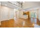 Open-concept living space with hardwood floors, high ceilings, and views to kitchen and stairway at 4790 Cascade Ave, Rock Hill, SC 29732