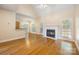 Open-concept living area with hardwood floors, fireplace, and ample natural light at 4790 Cascade Ave, Rock Hill, SC 29732