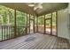 Screened porch with wood floors and railings overlooking a beautiful backyard at 4790 Cascade Ave, Rock Hill, SC 29732