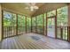 Relaxing screened porch with wooden floors, ceiling fan, and views of the backyard at 4790 Cascade Ave, Rock Hill, SC 29732