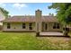 An exterior view of a home with green grass features a wood deck and privacy fence at 508 Long Creek Pkwy, Charlotte, NC 28214