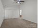 A carpeted bedroom offers neutral tones, double closets and ensuite access at 508 Long Creek Pkwy, Charlotte, NC 28214