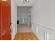 Welcoming foyer with hardwood floors leading into the carpeted living area with a fireplace at 508 Long Creek Pkwy, Charlotte, NC 28214