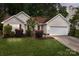 Charming one-story home boasts manicured lawn, fresh landscaping, and a two-car garage at 508 Long Creek Pkwy, Charlotte, NC 28214