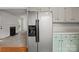 Traditional kitchen with a stainless steel refrigerator and green lower cabinets at 508 Long Creek Pkwy, Charlotte, NC 28214