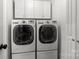 Bright laundry room with front loading washer and dryer at 508 Long Creek Pkwy, Charlotte, NC 28214