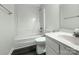Full bathroom with a shower-tub combo, toilet, and vanity with sink on dark wood laminate flooring at 628 Highland Ridge Rd, Mooresville, NC 28115
