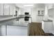 Bright kitchen with granite countertops, white cabinets, and stainless steel appliances at 628 Highland Ridge Rd, Mooresville, NC 28115