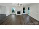 Open living room with fireplace, hardwood floors, and lots of natural light at 628 Highland Ridge Rd, Mooresville, NC 28115
