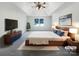 Inviting main bedroom with tray ceiling, king bed, and stylish modern furnishings at 628 Highland Ridge Rd, Mooresville, NC 28115