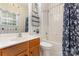 Full bathroom with a tub, shower and wood vanity with stylish mirror at 6729 Garden Hill Dr, Huntersville, NC 28078