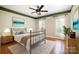 The bedroom features an earth tone color scheme and good natural light from the windows at 6729 Garden Hill Dr, Huntersville, NC 28078