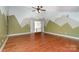 Bonus room with vaulted ceilings, hardwood floors and a mountain scene wall design at 6729 Garden Hill Dr, Huntersville, NC 28078