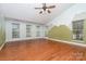Bonus room with vaulted ceilings, hardwood floors and a mountain scene wall design at 6729 Garden Hill Dr, Huntersville, NC 28078