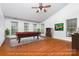 Virtual rendering of a bonus room with hardwood floors, a pool table, and lots of natural light from the windows at 6729 Garden Hill Dr, Huntersville, NC 28078