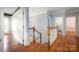 Hallway leads to the bathroom and bedroom with hardwood floors at 6729 Garden Hill Dr, Huntersville, NC 28078