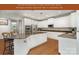 Kitchen featuring white cabinetry, granite countertops, stainless appliances, and seamless access to other rooms at 6729 Garden Hill Dr, Huntersville, NC 28078