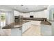 Spacious kitchen with white cabinets, granite countertops, stainless appliances, and an expansive island at 6729 Garden Hill Dr, Huntersville, NC 28078