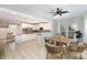 Bright eat-in kitchen featuring white cabinets, granite countertops, stainless appliances, and a cozy dining area at 6729 Garden Hill Dr, Huntersville, NC 28078
