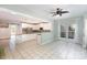 Bright kitchen boasting white cabinets, granite countertops, and seamless access to the sunroom with floor to ceiling windows at 6729 Garden Hill Dr, Huntersville, NC 28078