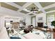 Cozy living room with coffered ceilings, fireplace, and an open view into kitchen for easy entertaining at 6729 Garden Hill Dr, Huntersville, NC 28078