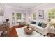Cozy living room with hardwood floors, bay windows, and lots of natural light at 6729 Garden Hill Dr, Huntersville, NC 28078