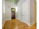 Bright foyer with hardwood floors, high ceilings, and a stylish wooden front door at 7324 Leharne Dr, Charlotte, NC 28270