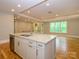 Kitchen island with granite countertop, stainless steel dishwasher, and open floorplan at 7324 Leharne Dr, Charlotte, NC 28270