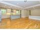 Modern kitchen featuring white cabinets, stainless steel appliances, and an island with a sink at 7324 Leharne Dr, Charlotte, NC 28270