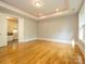 Bright, open space with hardwood floors, recessed lighting, and an ensuite bathroom at 7324 Leharne Dr, Charlotte, NC 28270