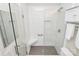 Contemporary bathroom with subway tile shower, glass door, and gray tiled floor at 9232 Four Mile Creek Rd, Charlotte, NC 28277