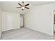Bright bedroom with neutral walls and carpet, ceiling fan, and ample natural light at 9232 Four Mile Creek Rd, Charlotte, NC 28277