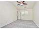 Bright bedroom with neutral walls and carpet, ceiling fan, and ample natural light at 9232 Four Mile Creek Rd, Charlotte, NC 28277