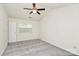 Spacious bedroom with carpet floors, ceiling fan, and natural light at 9232 Four Mile Creek Rd, Charlotte, NC 28277