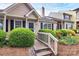 Charming home featuring manicured landscaping, a quaint walkway, and a welcoming entrance at 9232 Four Mile Creek Rd, Charlotte, NC 28277