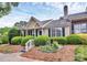 Inviting home with lush landscaping, complemented by colorful flowers and a well-maintained yard at 9232 Four Mile Creek Rd, Charlotte, NC 28277