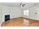 Hardwood floor living room has a fireplace and flows seamlessly to other rooms at 9232 Four Mile Creek Rd, Charlotte, NC 28277