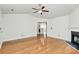 Open-concept living room boasting hardwood floors and a view into the kitchen at 9232 Four Mile Creek Rd, Charlotte, NC 28277